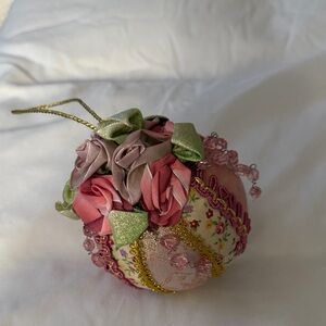 Floral Decorative Ornament with Pink and Green Accents